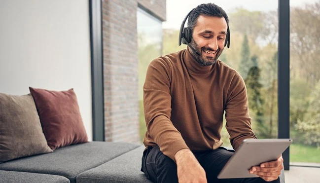 adapt-200---man-having-online-meeting-on-tablet