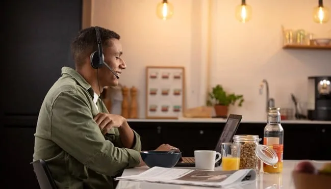 man-working-from-home-wearing-headset- EPOS- adapt-100- series